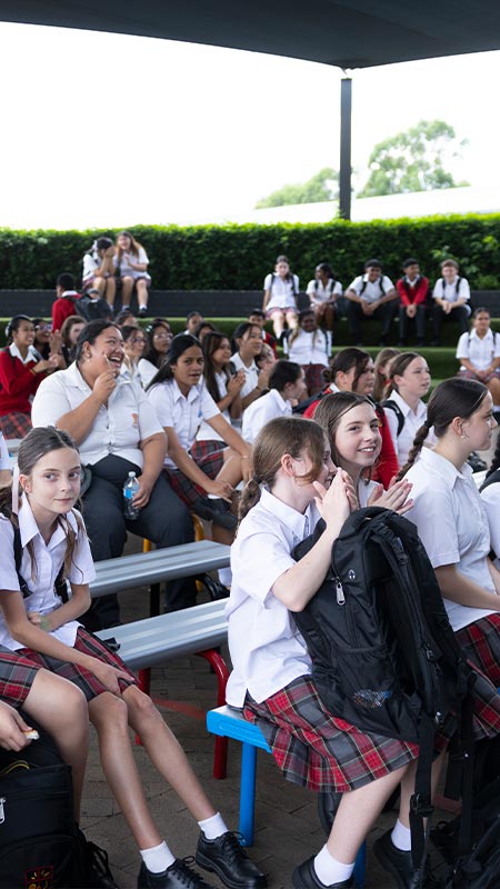 St Clare’s Hassall Grove students sitting in the amphitheatre