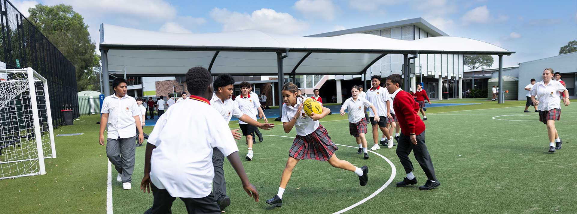 St Clare’s Hassall Grove students playing soccer on school sports field