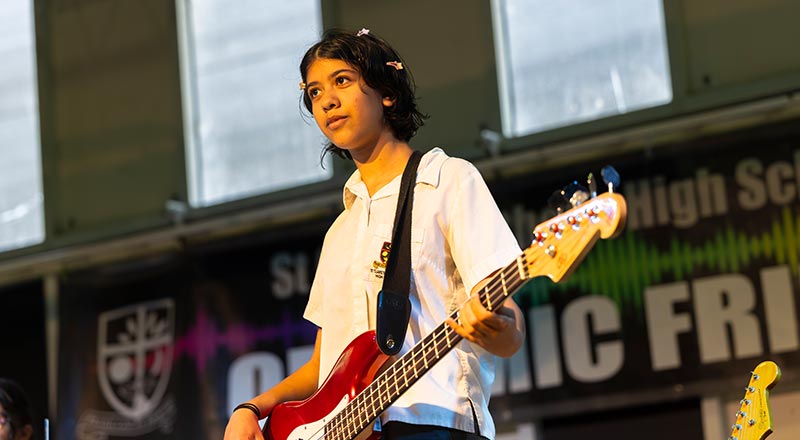 St Clare’s Hassall Grove students performing, playing bass