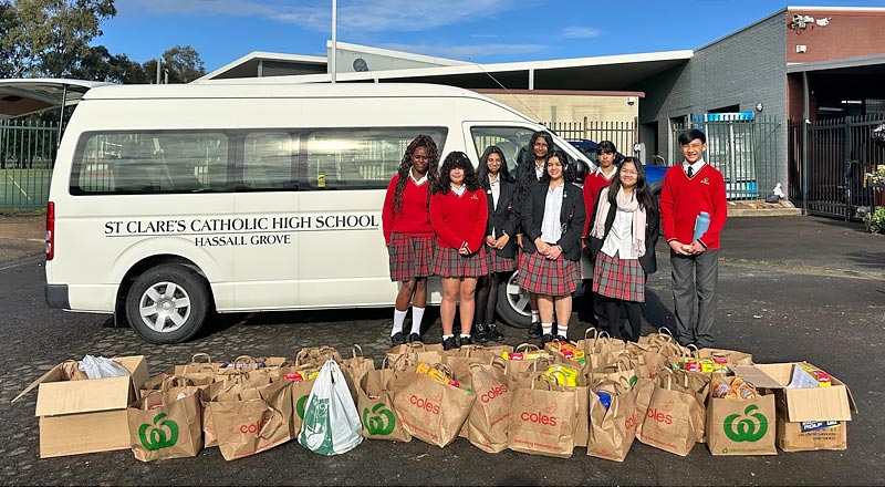 St Clare's Hassall Grove students donating to charity