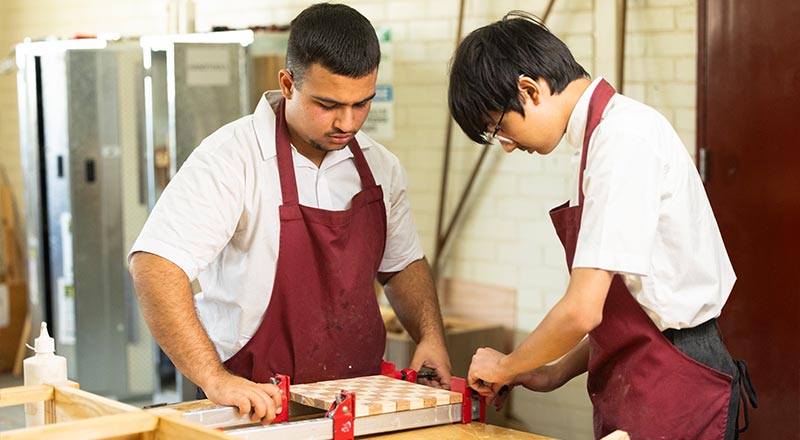 St Clare's students in industrial woodwork class