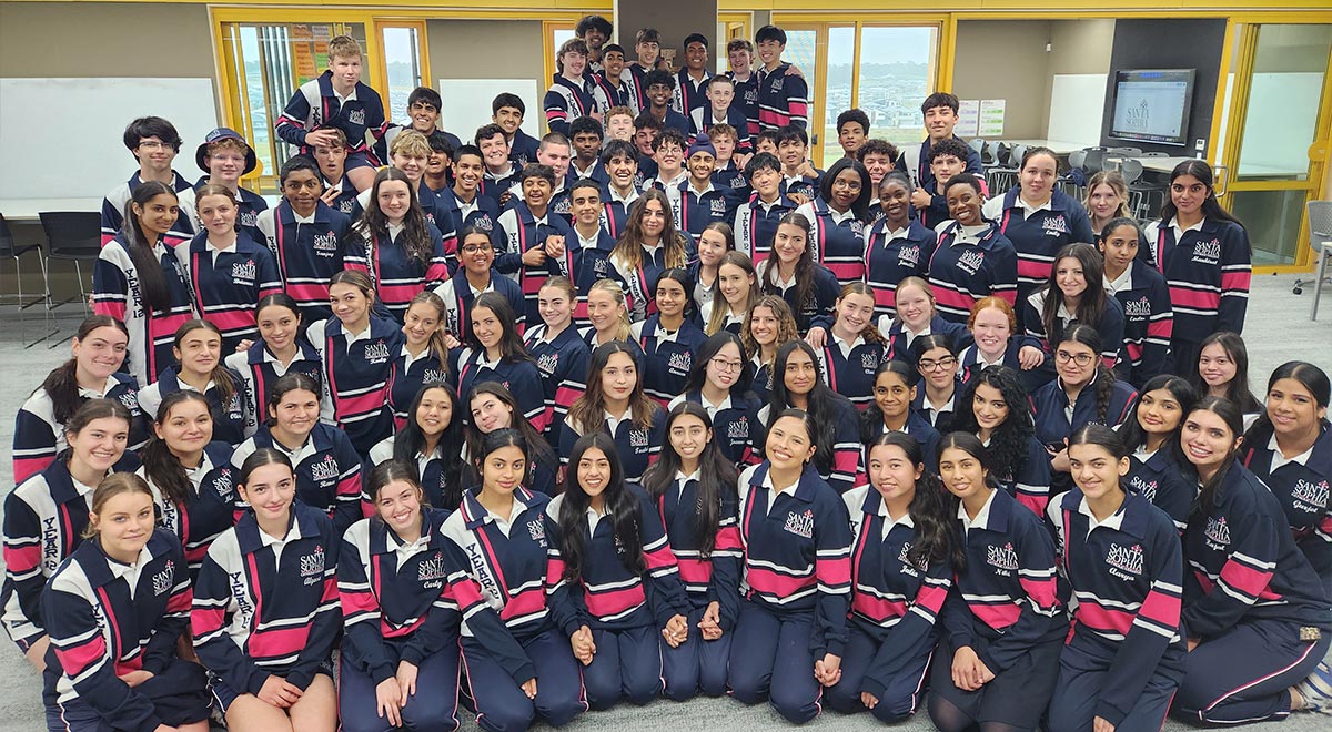Santa Sophia Catholic College Gables students sitting on steps